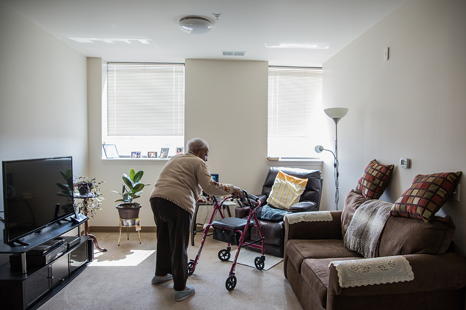 Aquilla Richardson walks through her Rivertown Assisted Living Apartment.