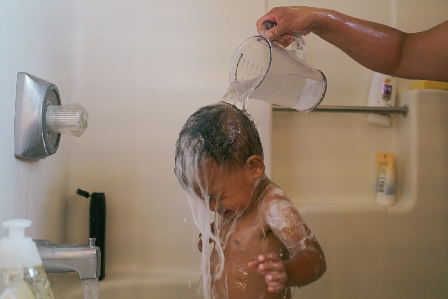 Desirae gives LaRose Leigh a bath before bedtime in the family home.