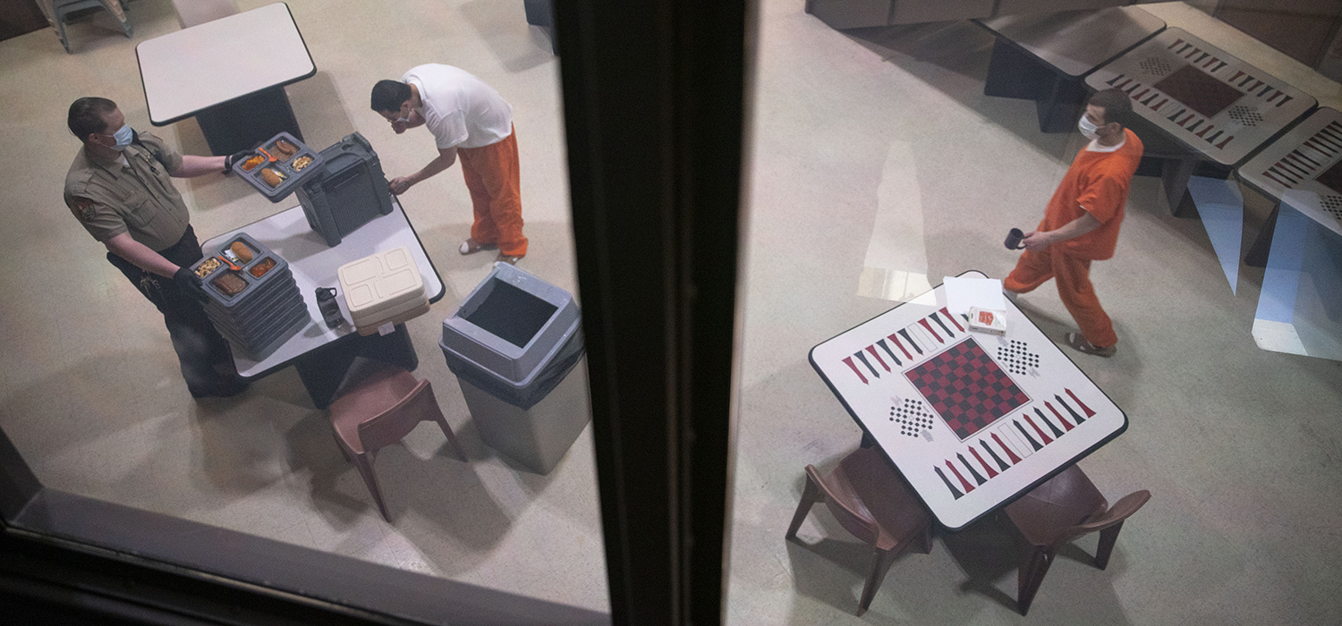 Incarcerated people don masks and receive lunch at St. Louis County Jail