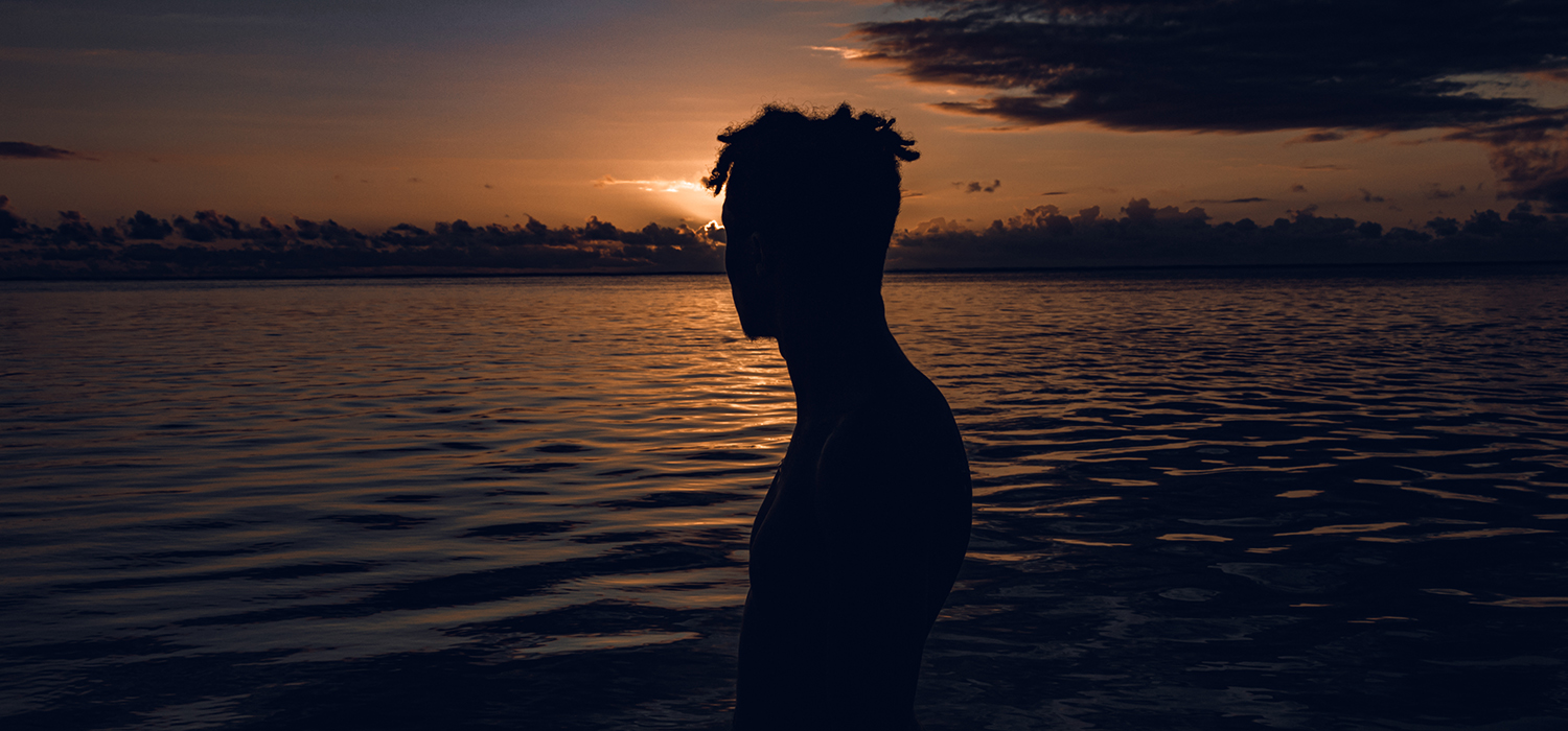 Man looks at water