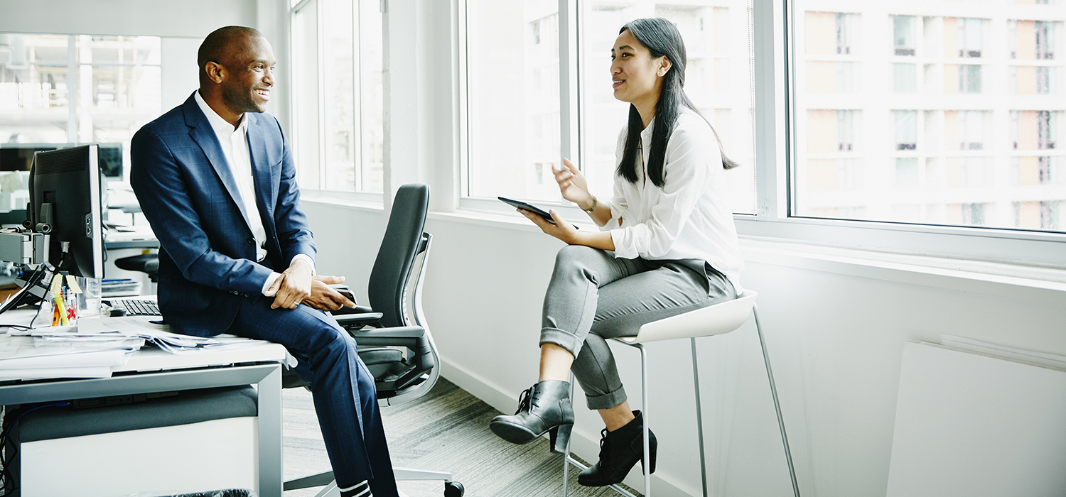 Colleagues speak at work