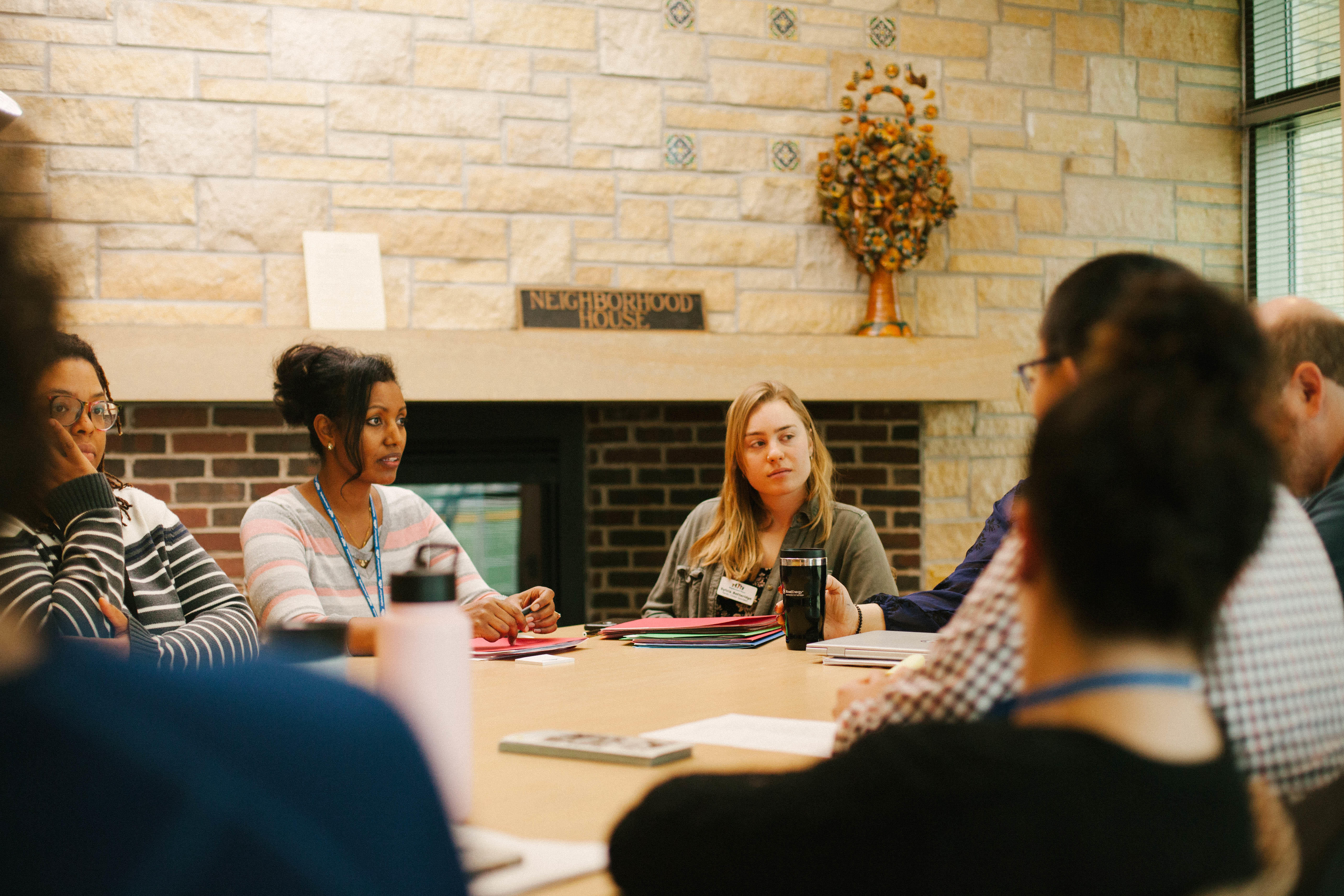 Representatives from organizations involved in the Crisis Clinic pilot hold a debrief meeting after the morning clinic ends.