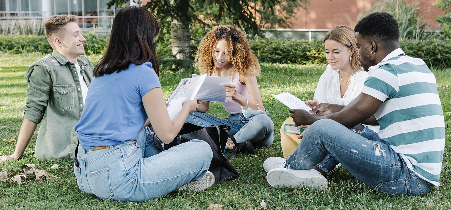 College students studying together outside. 