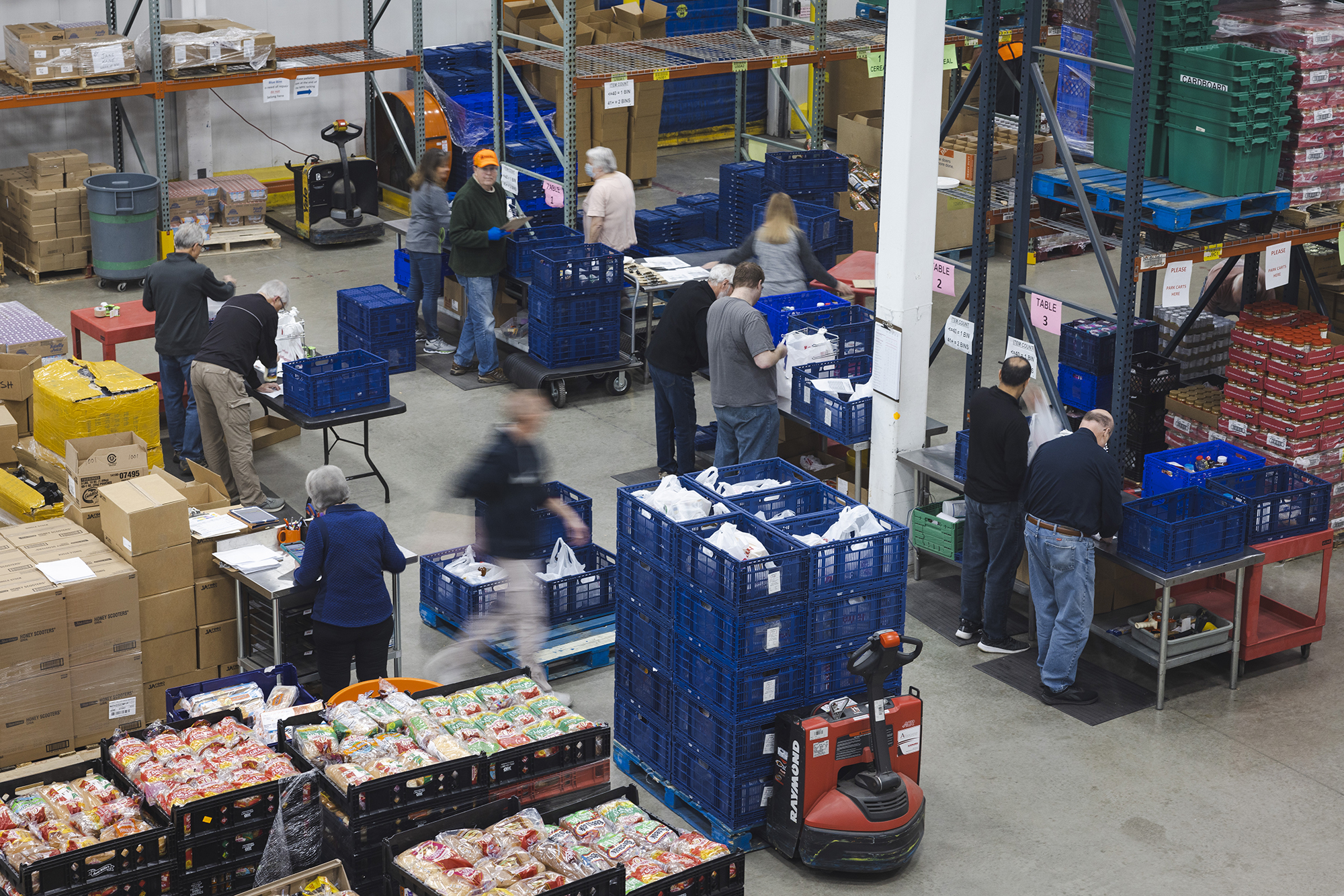 Volunteers pack My Pantry Express orders in the Northern Illinois Food Bank warehouse. 