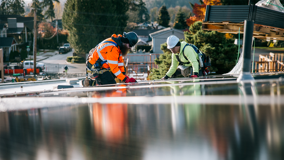 Workers installing solar pannels