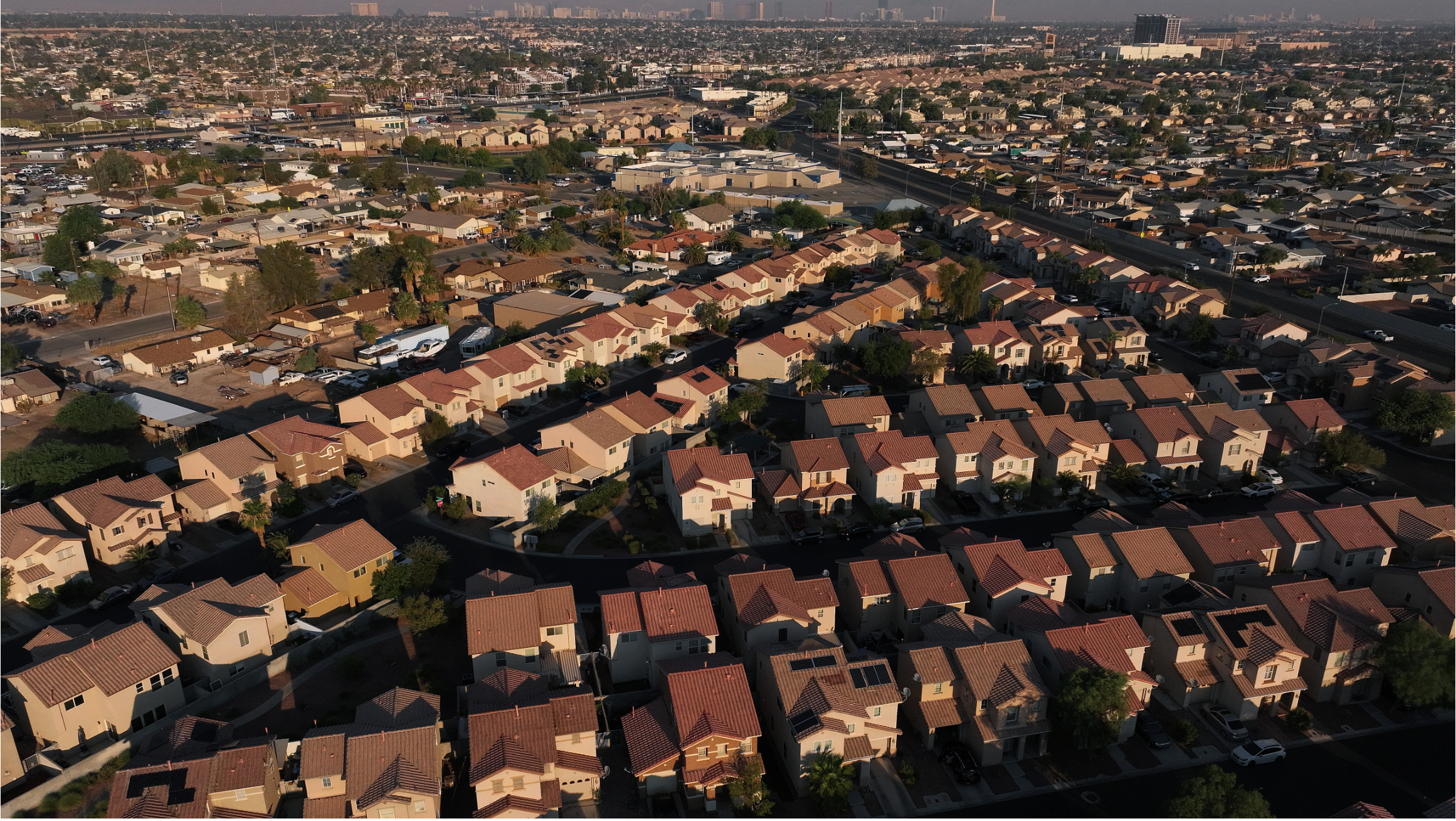 Aerial view of a suburban neighborhood with rows of single-family homes.