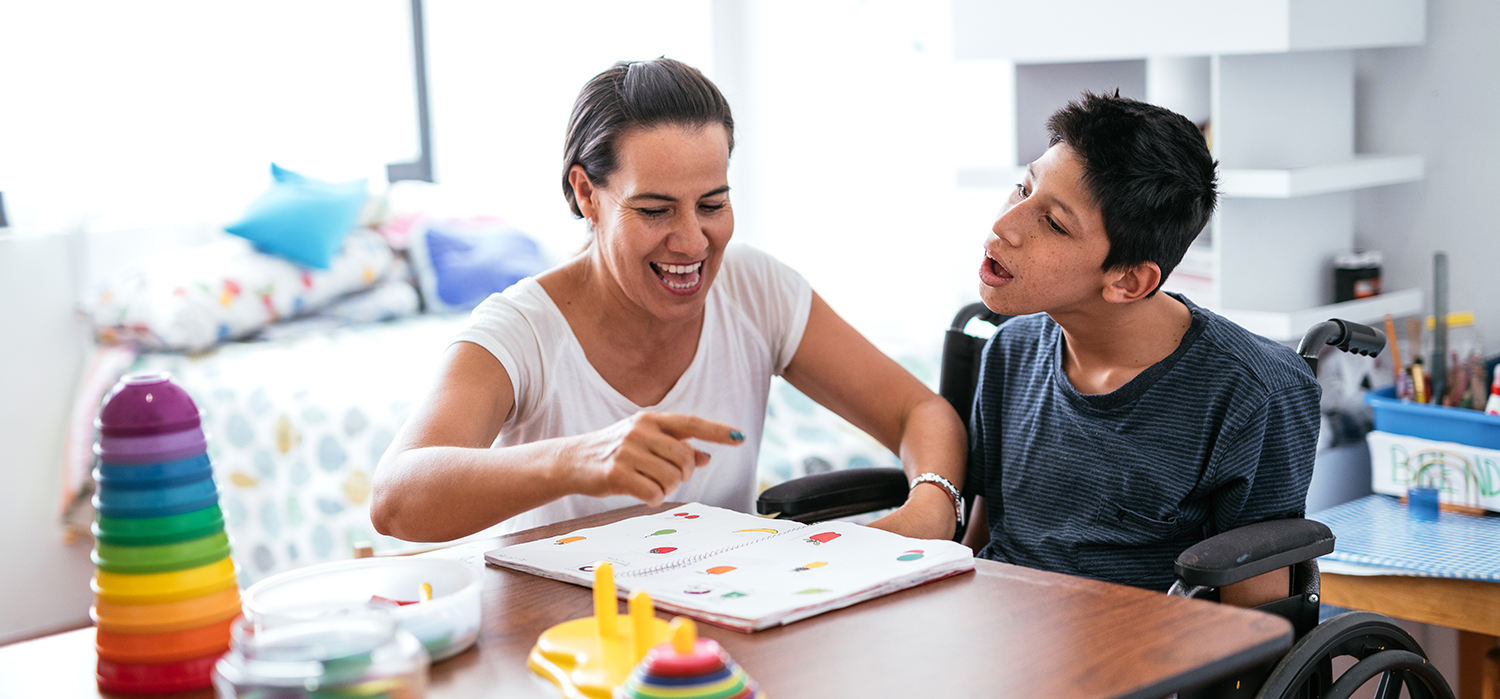 Parent teaches their child with a disability at home