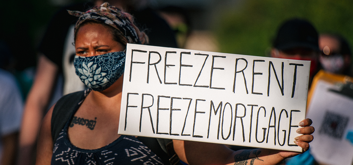 Freeze rent freeze mortgage sign at a march