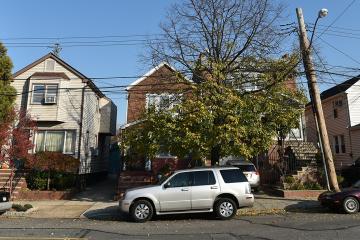View of a street in a residential neighbourhood of the borough of Queens.