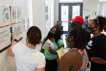 People gathering to view bulltien board