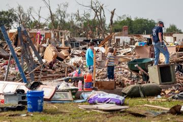 Family in storm rubble 