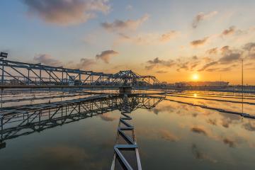 Sewage treatment plant with sunrise stock photo