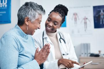 photo of Black woman, doctor and elderly patient with tablet and results for health
