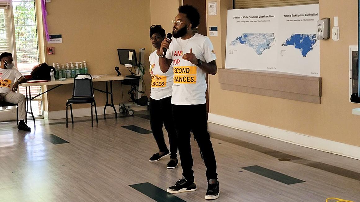 Two Forward Justice speakers giving a presentation