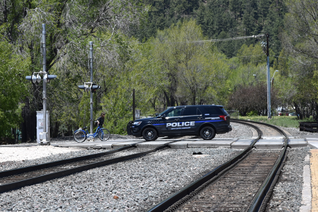 Flagstaff police car crossing the railroad tracks in Flagstaff Arizona