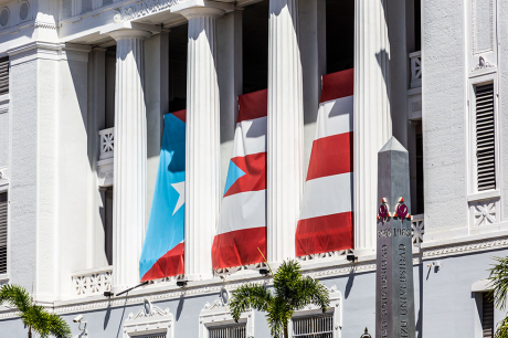 photo of government building in Old San Juan, Puerto Rico with Puerto Rican flag