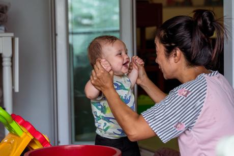 A mother playing with her child.