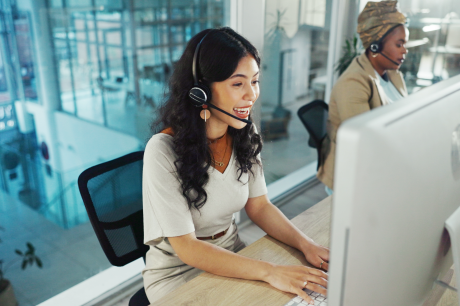 photo of woman at computer on hotline