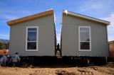 Workers constructing a manufactured home.