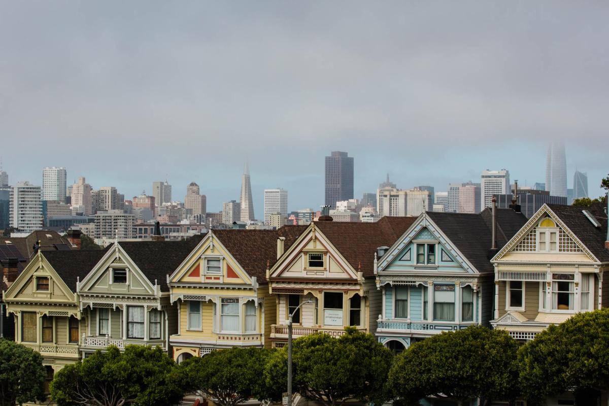 The Painted Ladies, a row of pastel Victorian houses, are a popular tourist destination in San Francisco’s Alamo Square.